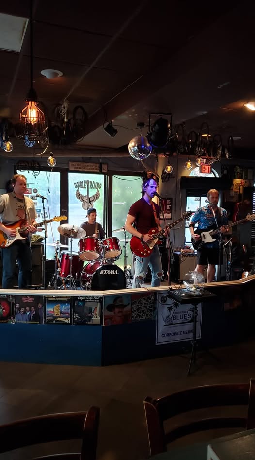 Mark Marra performing with band at a venue